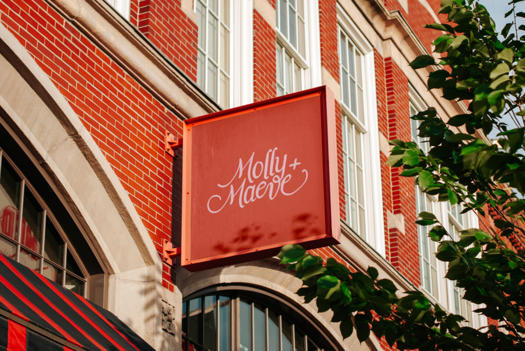Molly & Maeve Design Logo on outdoor sign.